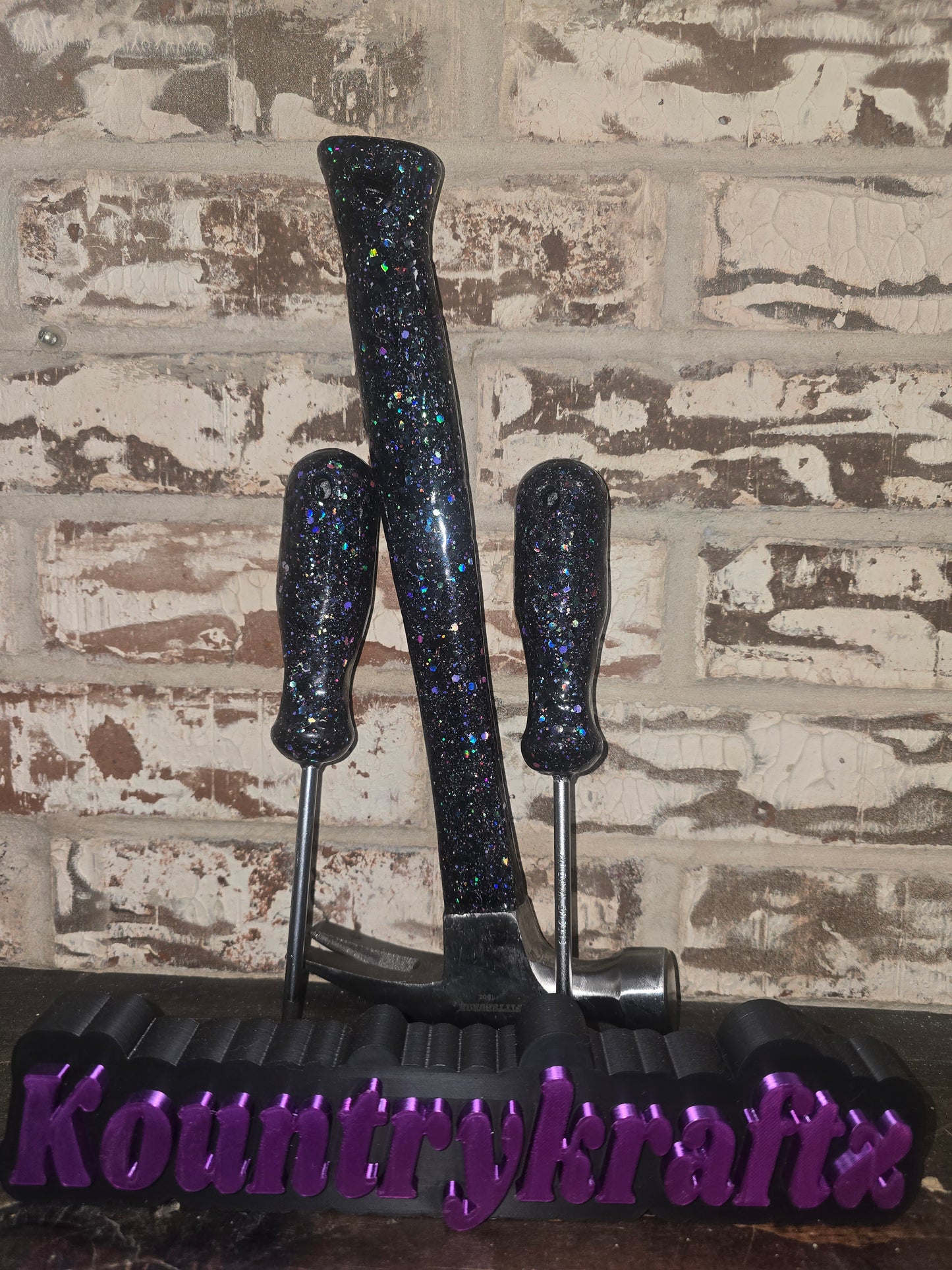 Black with pops of purple glittered hammer and screwdriver set