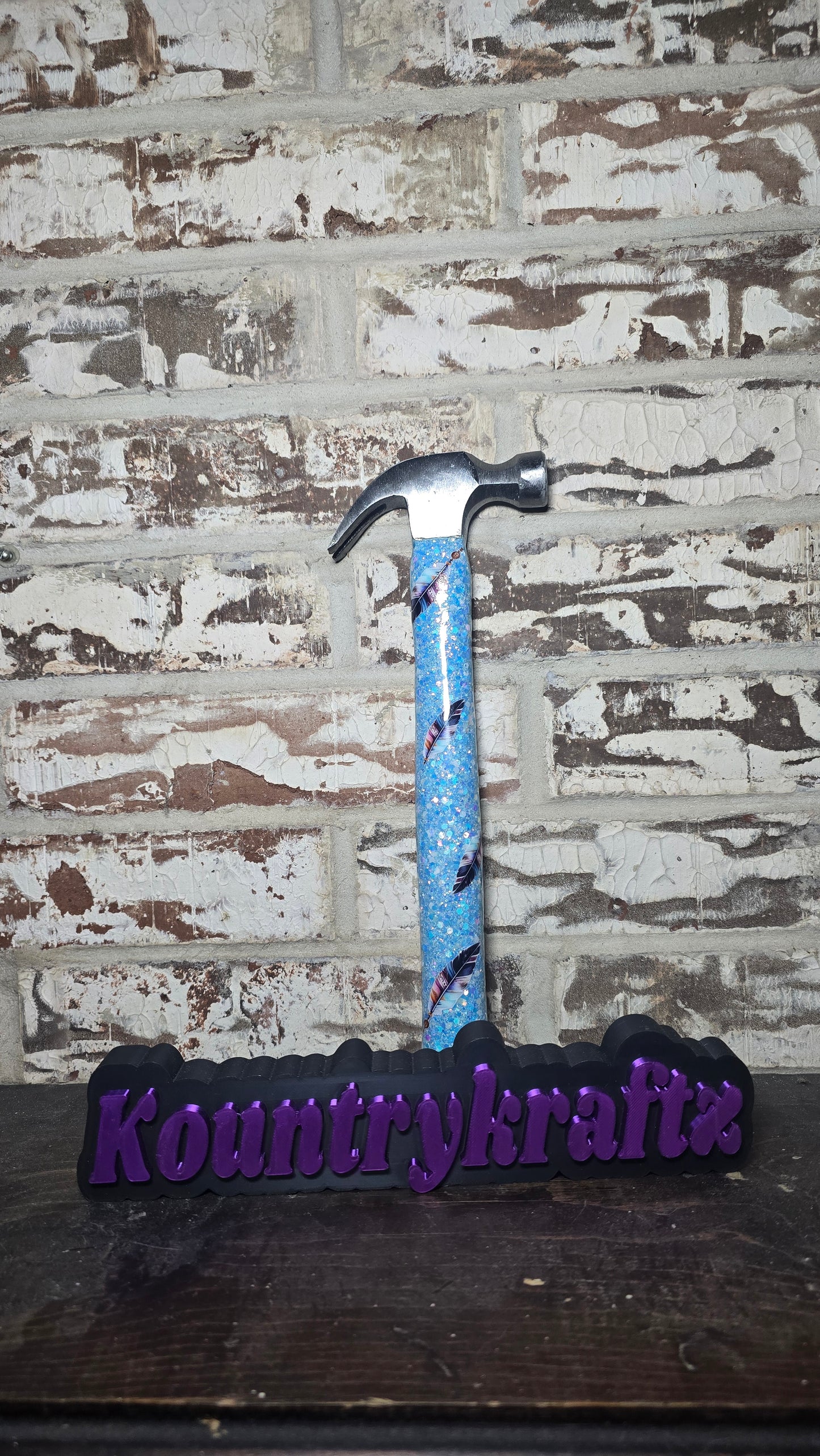 Small hammer with feather decals