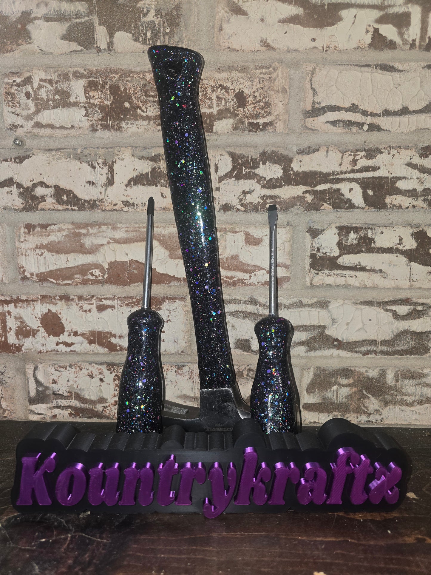 Black with pops of purple glittered hammer and screwdriver set
