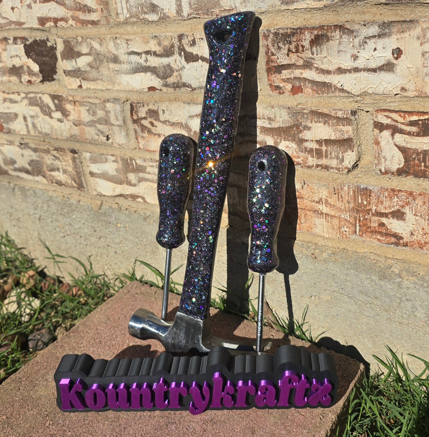 Black with pops of purple glittered hammer and screwdriver set
